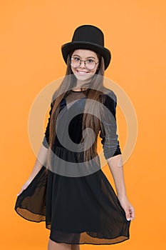 Without compromising on style. Happy girl wear dress with hat. Fashion look of little child. Style and fashion. Party