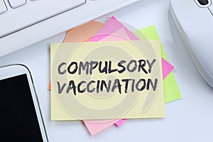 Compulsory vaccination against coronavirus vaccine hesitancy corona virus COVID-19 Covid computer note paper