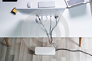 Compute And Laptop With Cable Organizer Box At Office