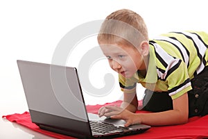 Computer addiction emotional boy with laptop