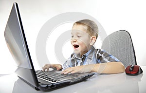 Computer addiction emotional boy with laptop