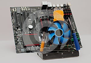 Computer assembly details and tools on a white background