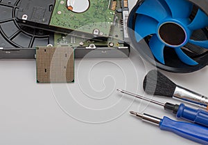 Computer assembly details and tools on a white background