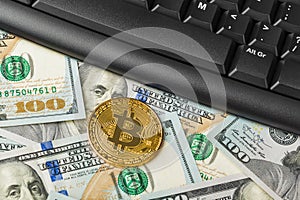 Computer and bitcoins on money - business background