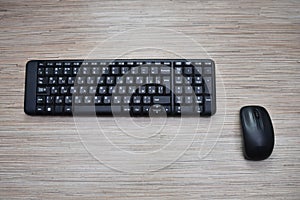 Computer black keyboard and mouse on the table