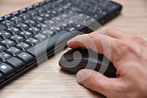 Computer black keyboard and mouse on the table