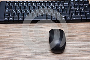 Computer black keyboard and mouse on the table