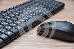 Computer black keyboard and mouse on the table