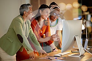 Computer, business and a female leader with her team, working overtime together in the office at night. Collaboration