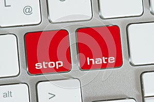 A computer and buttons for stop hatred photo