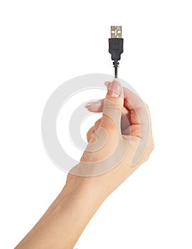 Computer cable usb in hand isolated on white background photo
