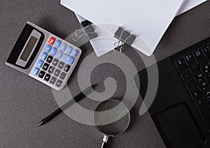 Computer, calculator, documents and magnifier, for financial reporting. Business offices concept