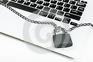 Computer with chain and padlock on a white background. internet security concept.