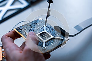 Computer chip electronic repair. Hardware engineer technology maintenance. Man technician pc service.