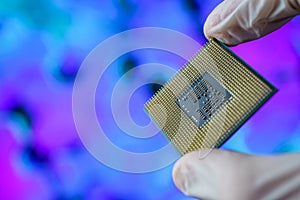 Computer chip in hands. A chipset is a set of electronic component that is integrated and flows data between the processor.