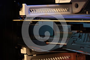 Computer circuit board and CPU cooling fans illuminated by internal LEDs inside a server class computer.