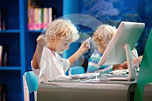 Computer class for school kids. Children study