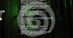 Computer code image over server racks in dark room