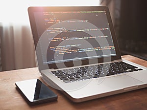 Computer code on laptop web developing and cellphone