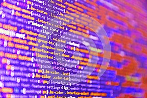 Computer code on laptop web developing. Shallow depth of field, selective focus effect. Programming code abstract screen of