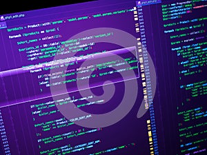 Computer code on the screen (web developing). PHP code on purple background