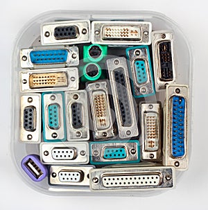 Computer connectors and adapters in plastic jar