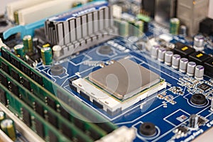 Computer CPU close-up on the motherboard background, socket of central process unit, connection of cpu