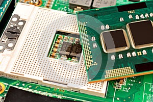 Computer CPU close-up on the motherboard background, socket of central process unit, connection of  cpu with motherboard