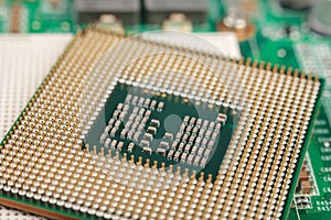 Computer CPU close-up on the motherboard background, socket of central process unit, connection of  cpu with motherboard,  the str