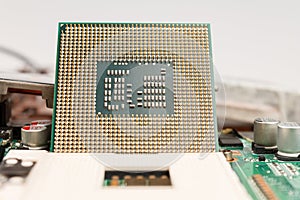 Computer CPU close-up on the motherboard background, socket of central process unit, connection of  cpu with motherboard,  the str