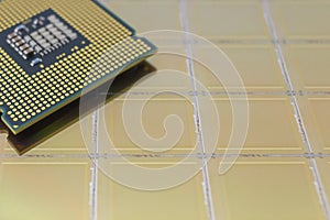 Computer CPU processor chip on yellow surface of slicion wafer chip background