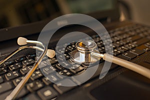 Computer or data analysis - Stethoscope over notebook keyboard