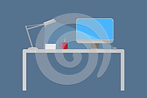 Computer desk at night with light on