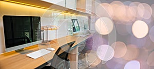 Computer desktop blank screen in front of window in office