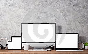 Computer desktop, laptop, smart phone with blank screen and other accesories on wood table, workspace mockup design, illustration