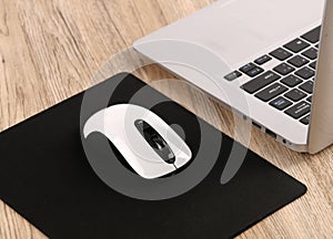 Computer desktop with white keyboard and mouse on working desk