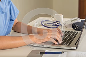 Computer and doctor`s hand