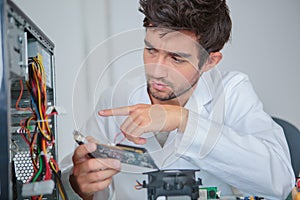 computer engineer during motherboard fabricator photo