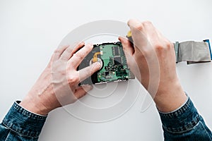 Computer engineer performs urgent repairs recovery of lost data during deletion HDD photo