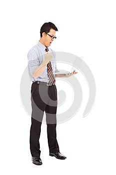 Computer engineer is standing and clench his hand