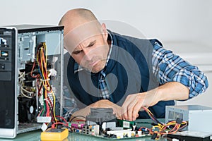 computer engineer working on broken console