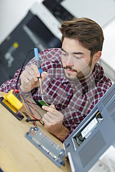 Computer engineer working on broken console