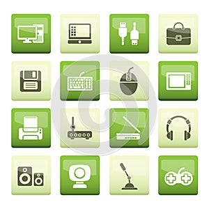 Computer equipment and periphery icons over green background photo