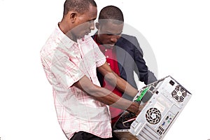 A computer expert repairs a computer