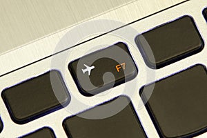 Computer f7 key turn on off flight airplane safe mode photo