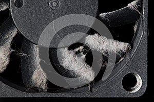 Computer fan with blades covered with a layer of dust