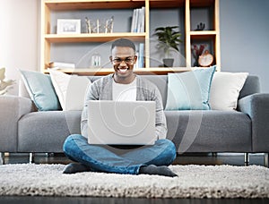 Computer, floor and portrait of man in home, online research and typing in living room for work or career opportunity