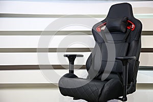 Computer gaming chair on a striped background