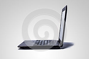 A computer on grey background.