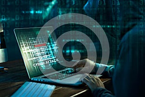 Computer hacker. Internet crime working on a code on laptop